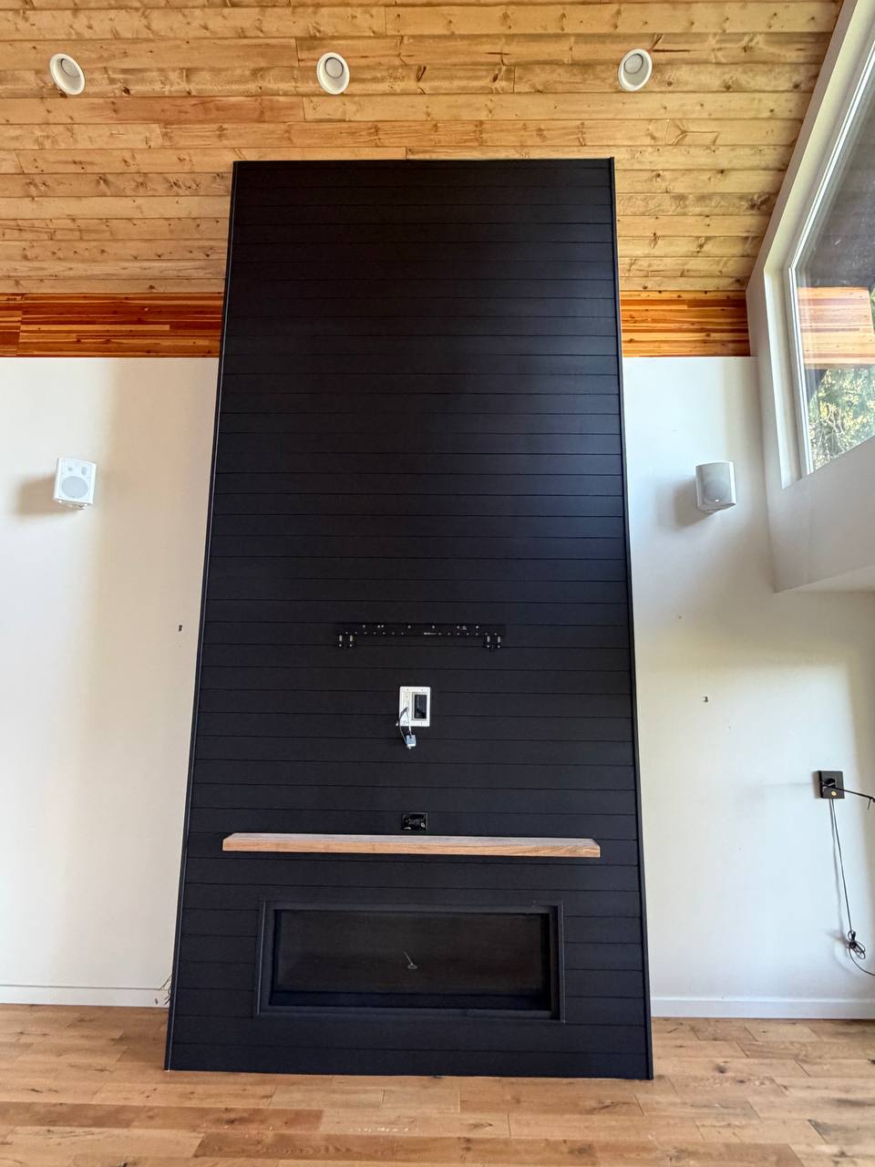 Floor-to-Ceiling Black Shiplap Fireplace